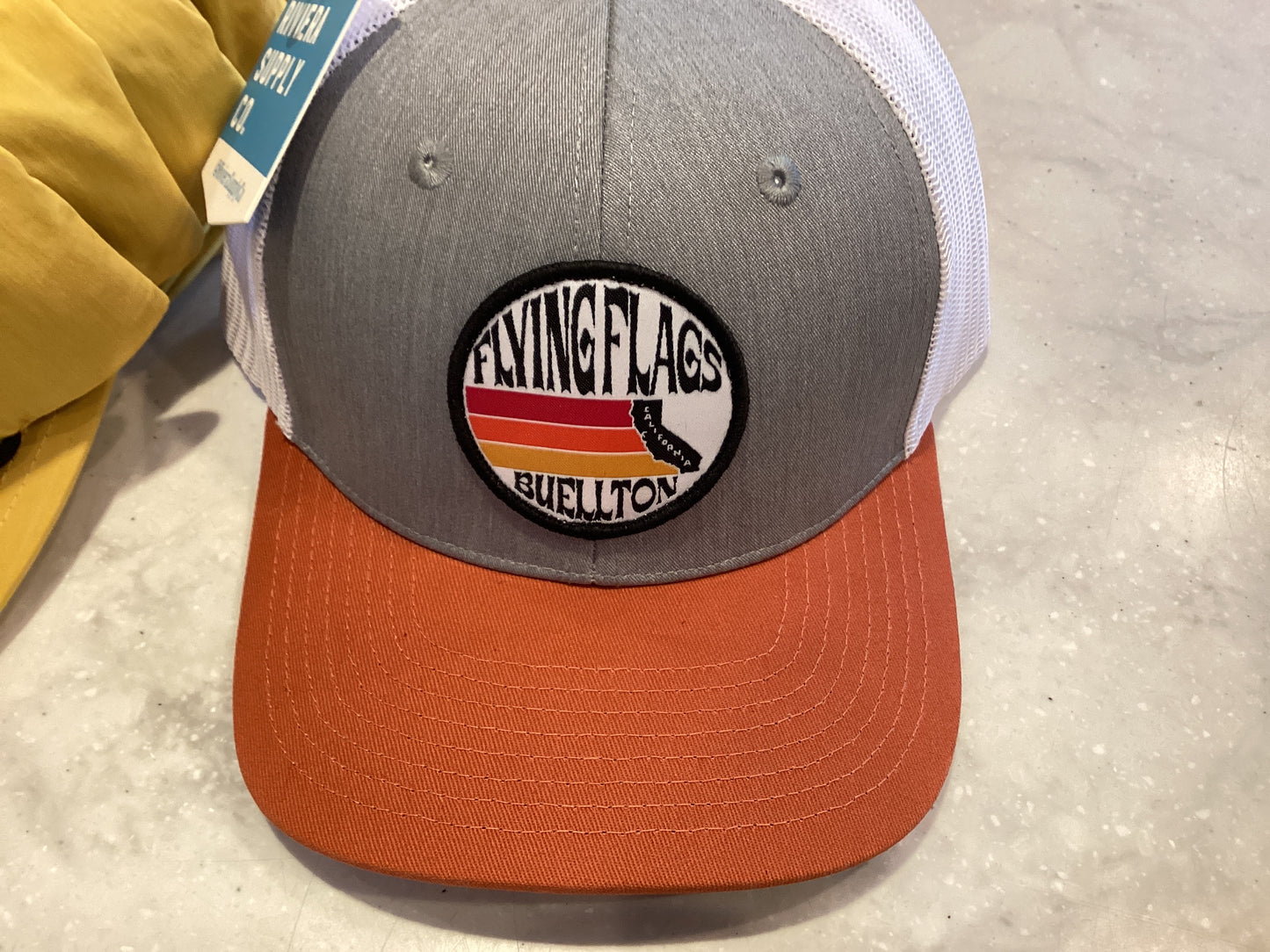 Flying flags CA Buellton trucker hat