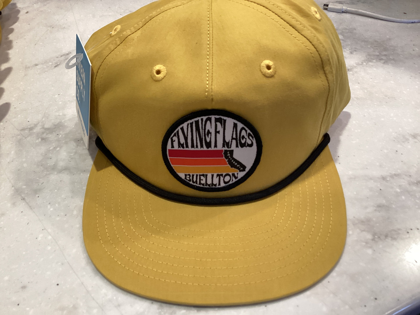 Flying flags CA Buellton trucker hat